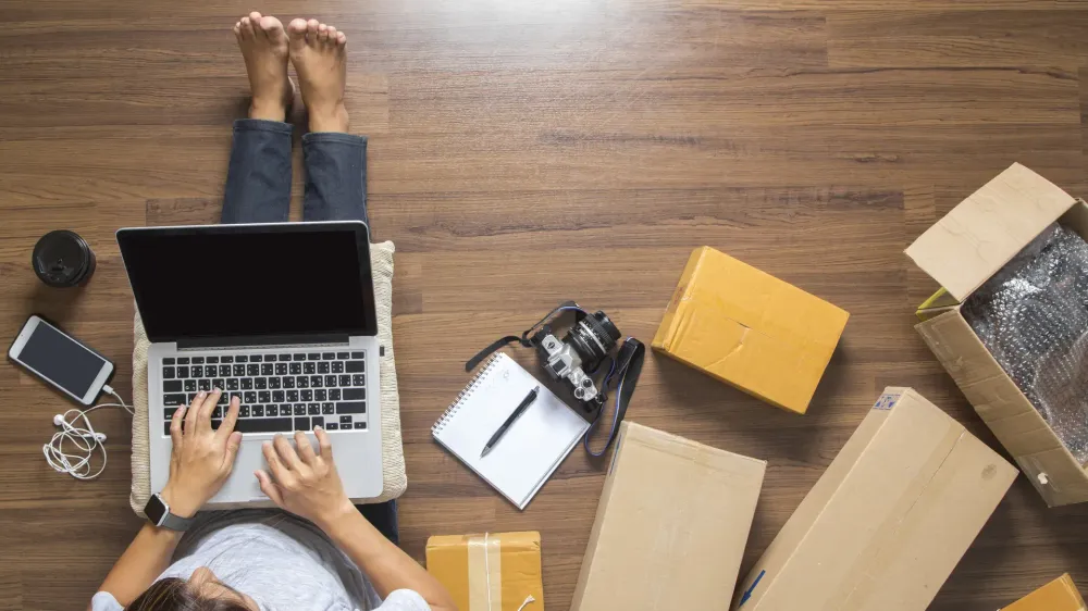 person on computer with boxes around